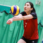 Woman playing volleyball in Indoor Sports Centre gym. Links to Volleyball club page on Bristol SU Website.